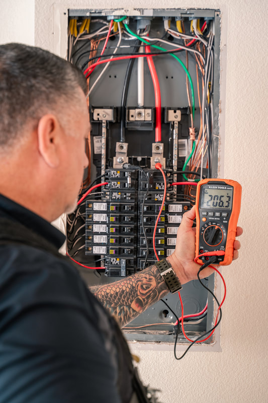 Electrical Panel Inspector Inspecting A Panel